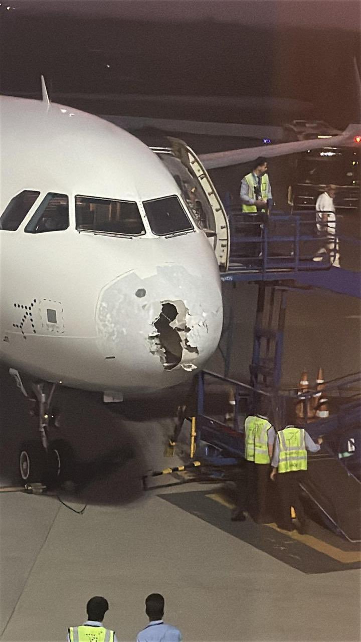 a plane with a hole in the front